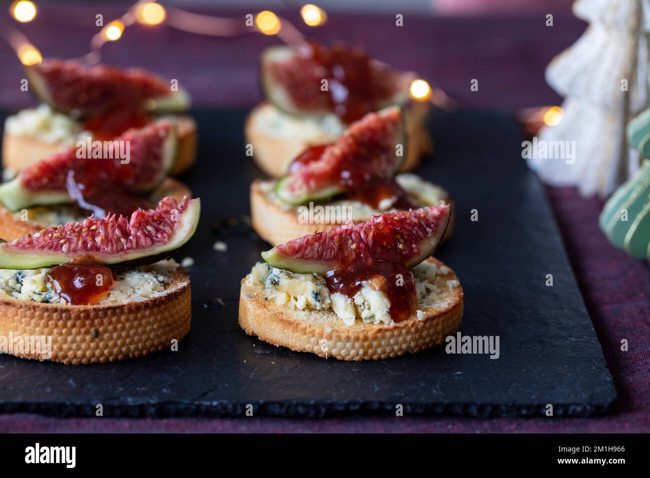 Christmas canapes with stilton cheese and frsh figs Stock Photo