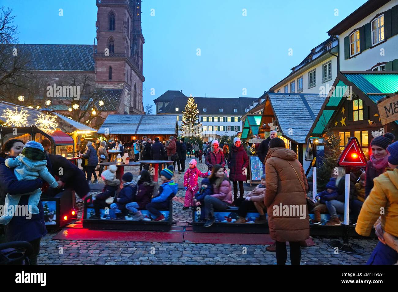 Christmas market in the Munsterplatz, near the Basel cathedral. Basel, Switzerland - December 2022 Stock Photo