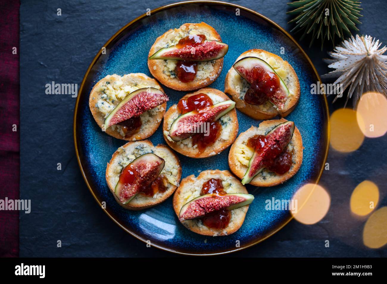 Christmas canapes with stilton cheese and fresh figs Stock Photo
