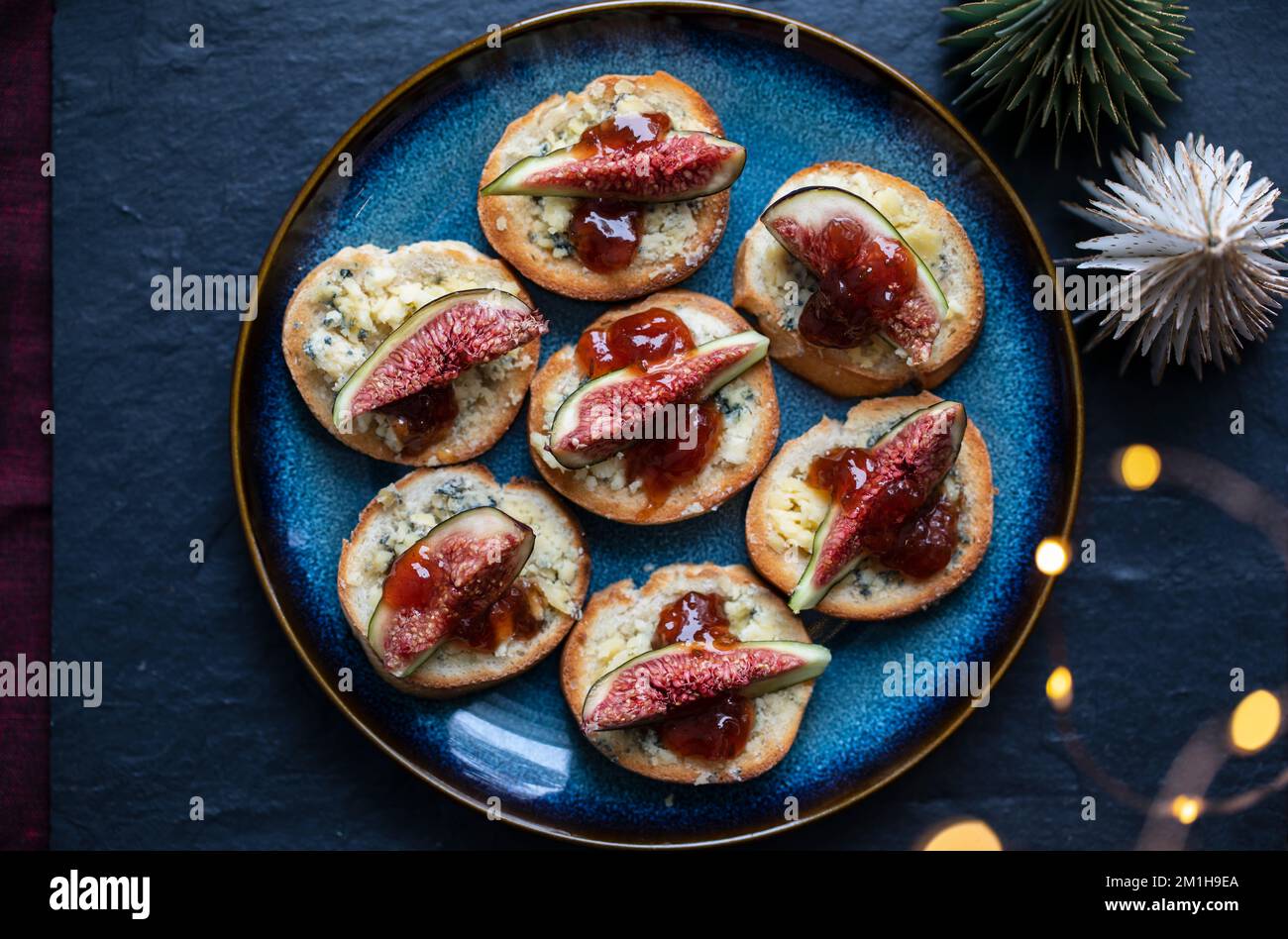 Christmas canapes with stilton cheese and fresh figs Stock Photo