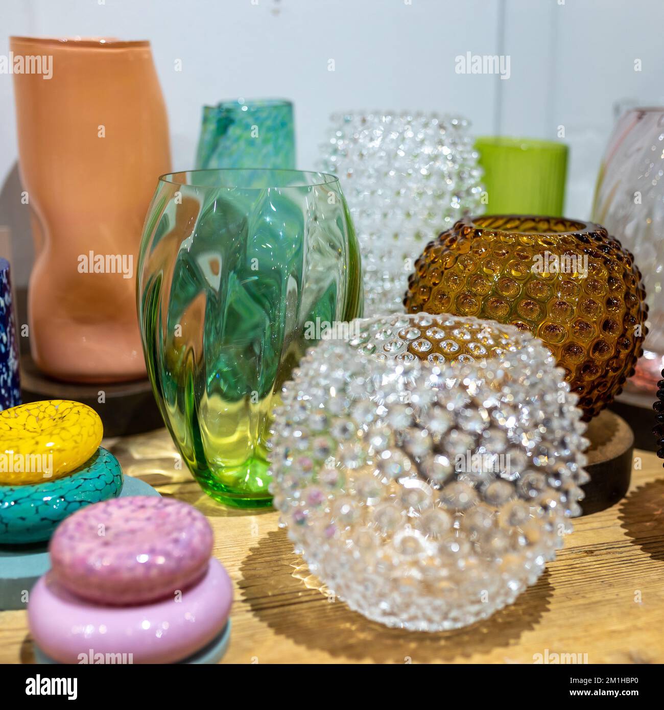 London, UK - 10 December 2022, Liberty Luxury department store. Multi-colored glass vases in different shapes at a local market for sale Stock Photo