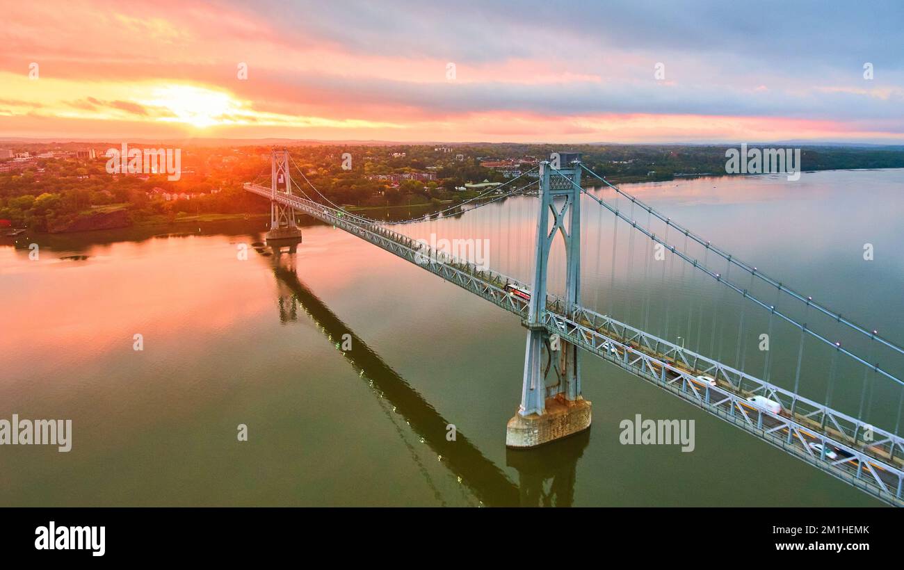 Hudson River bridge aerial with stunning pink and gold sunrise light Stock Photo