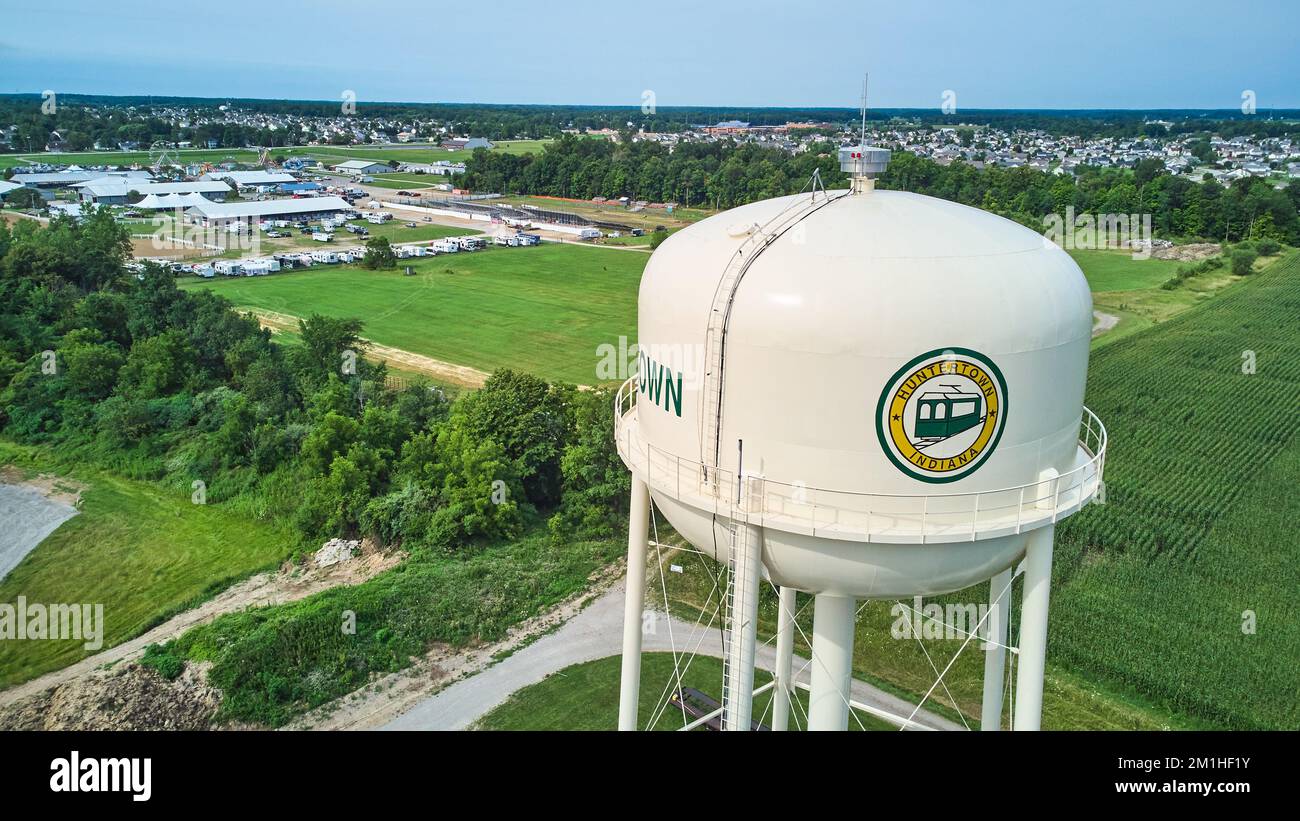 Aerial of Huntertown, Indiana water tower utility with farming and