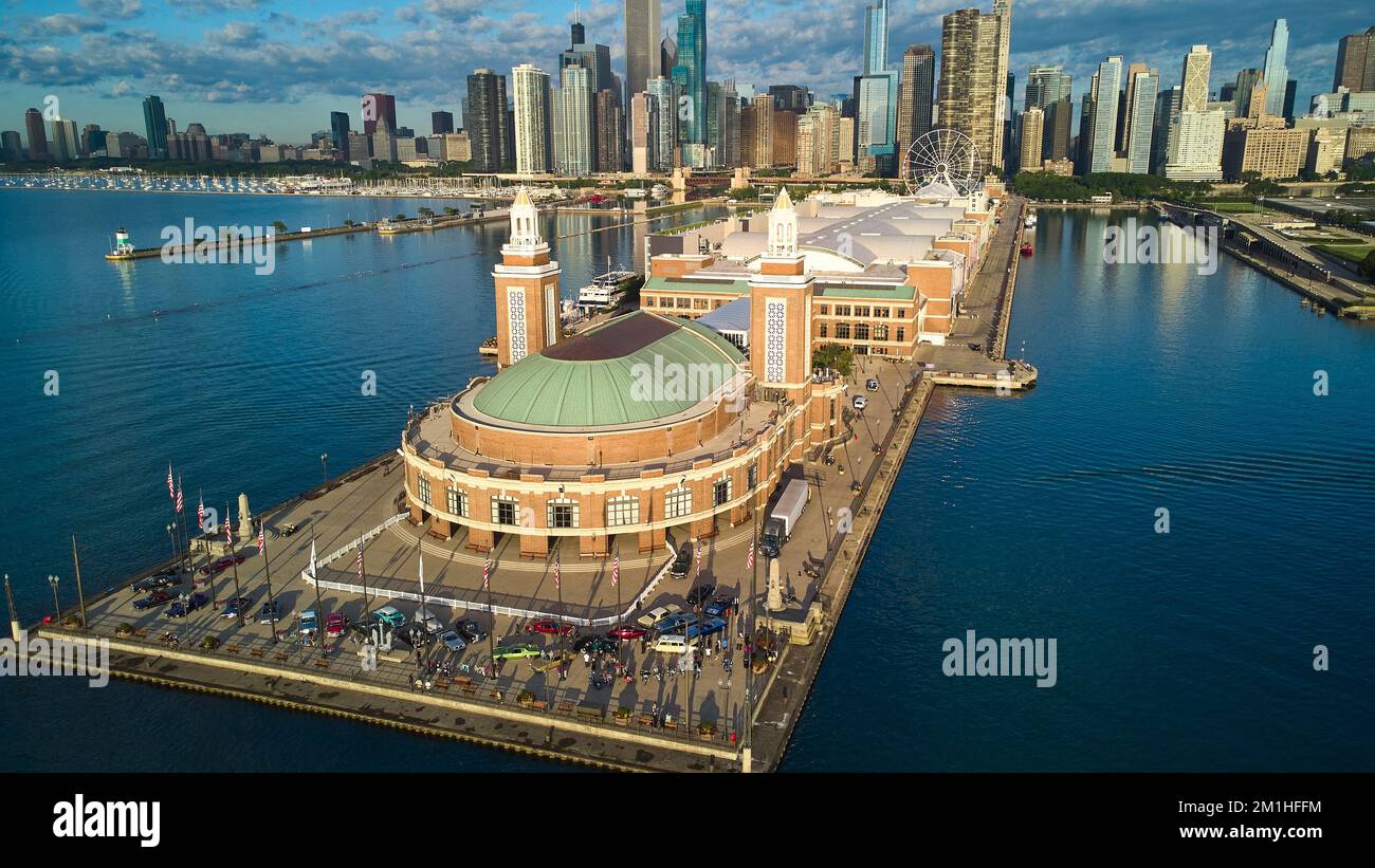 Aerial over end of Navy Pier during vintage car show with view of