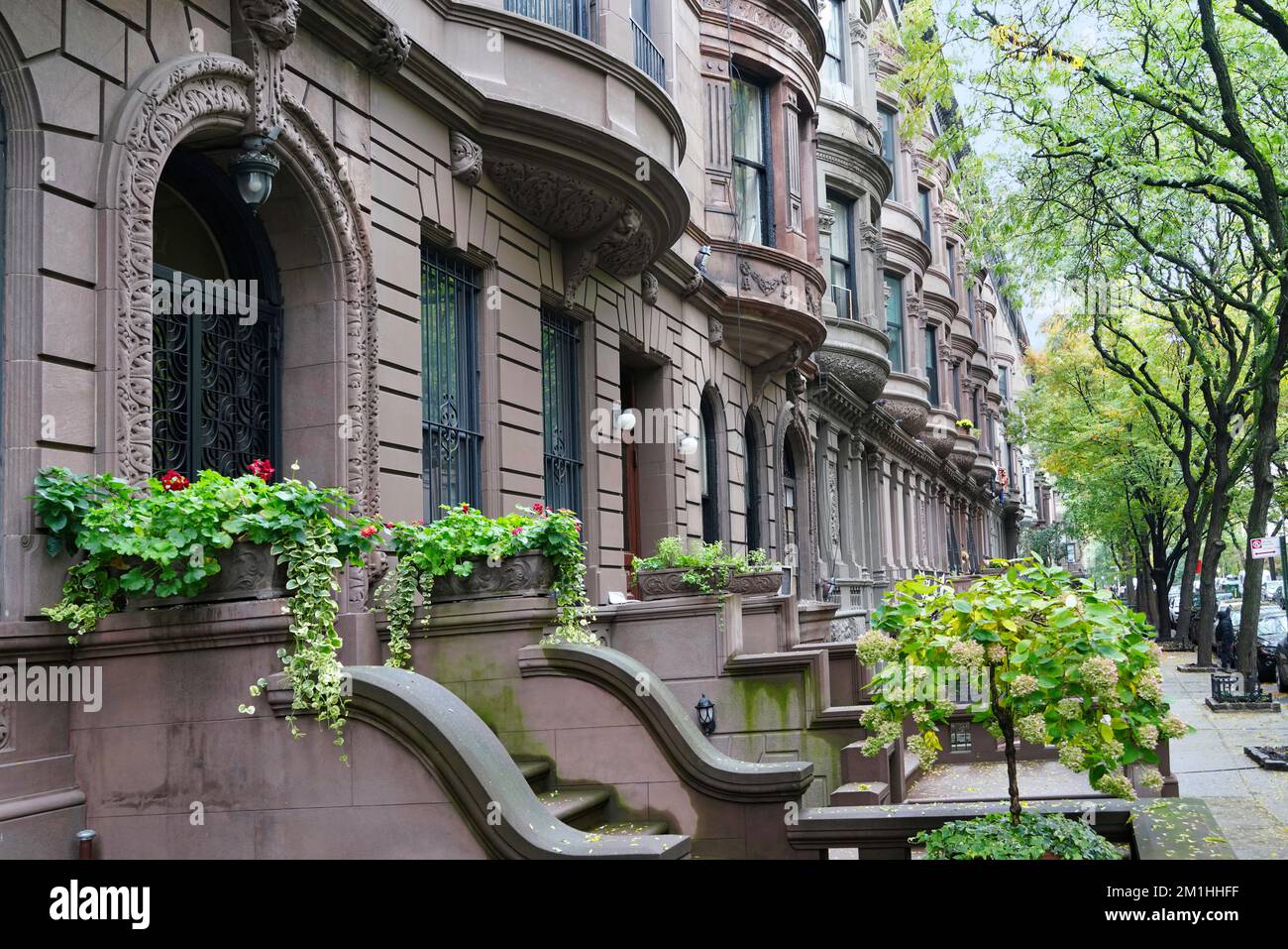 Manhattan, west 87th street with long row of brownstone townhouses, upper west side, constructed late 1800s Stock Photo