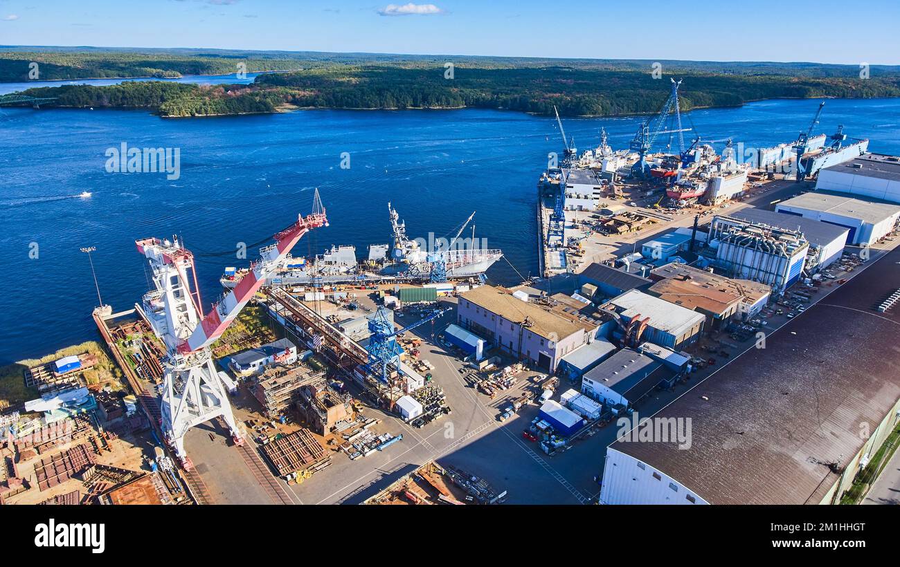 Ship Made Shipyard on Maine river from above as many large ships are being built ...