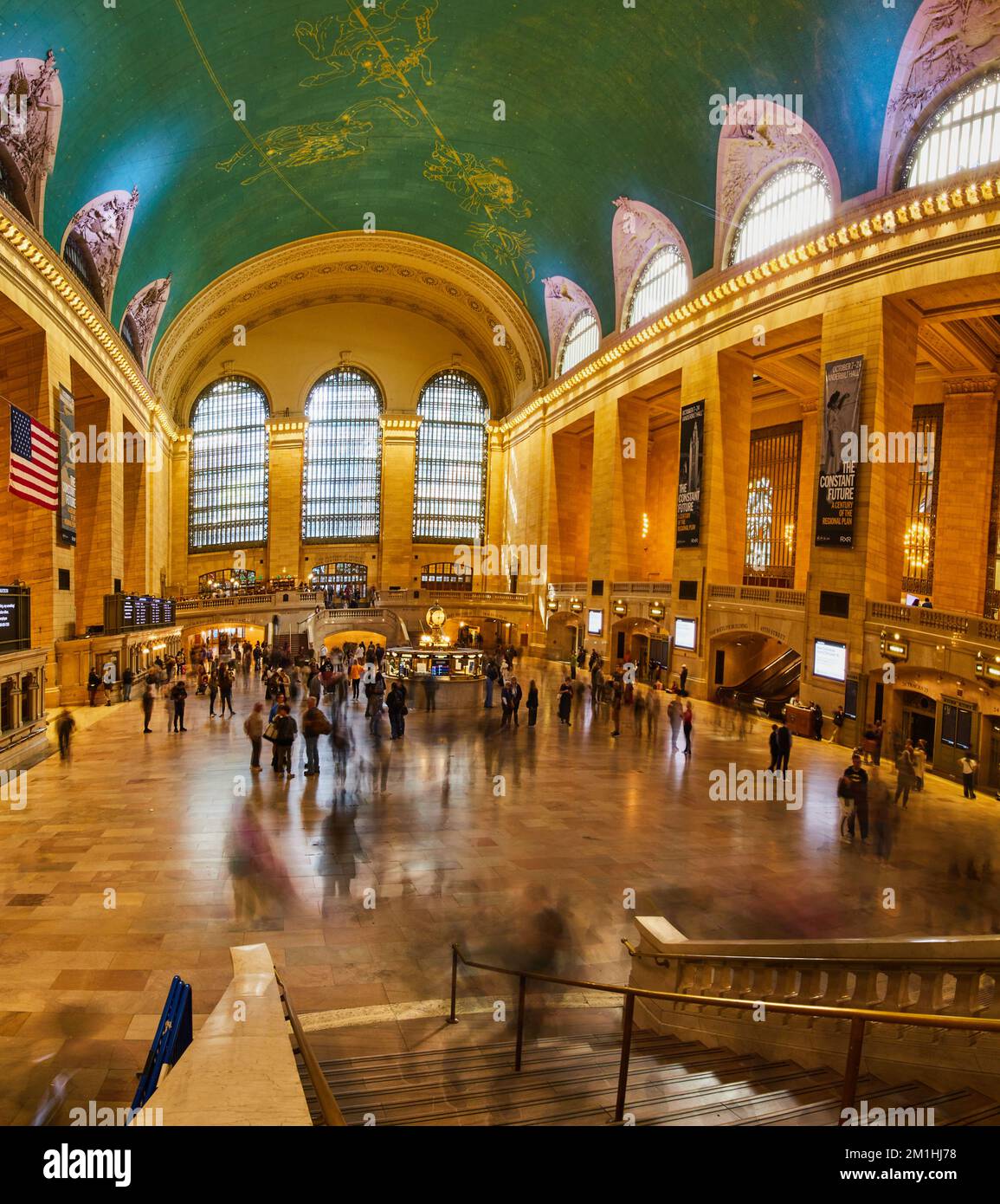 People fill iconic Grand Central Station wide panorama by stairs in New York City Stock Photo