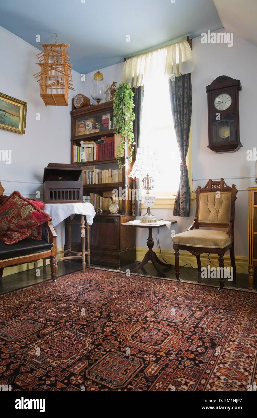 Eastlake upholstered chair and antique furnishings in upstairs room ...