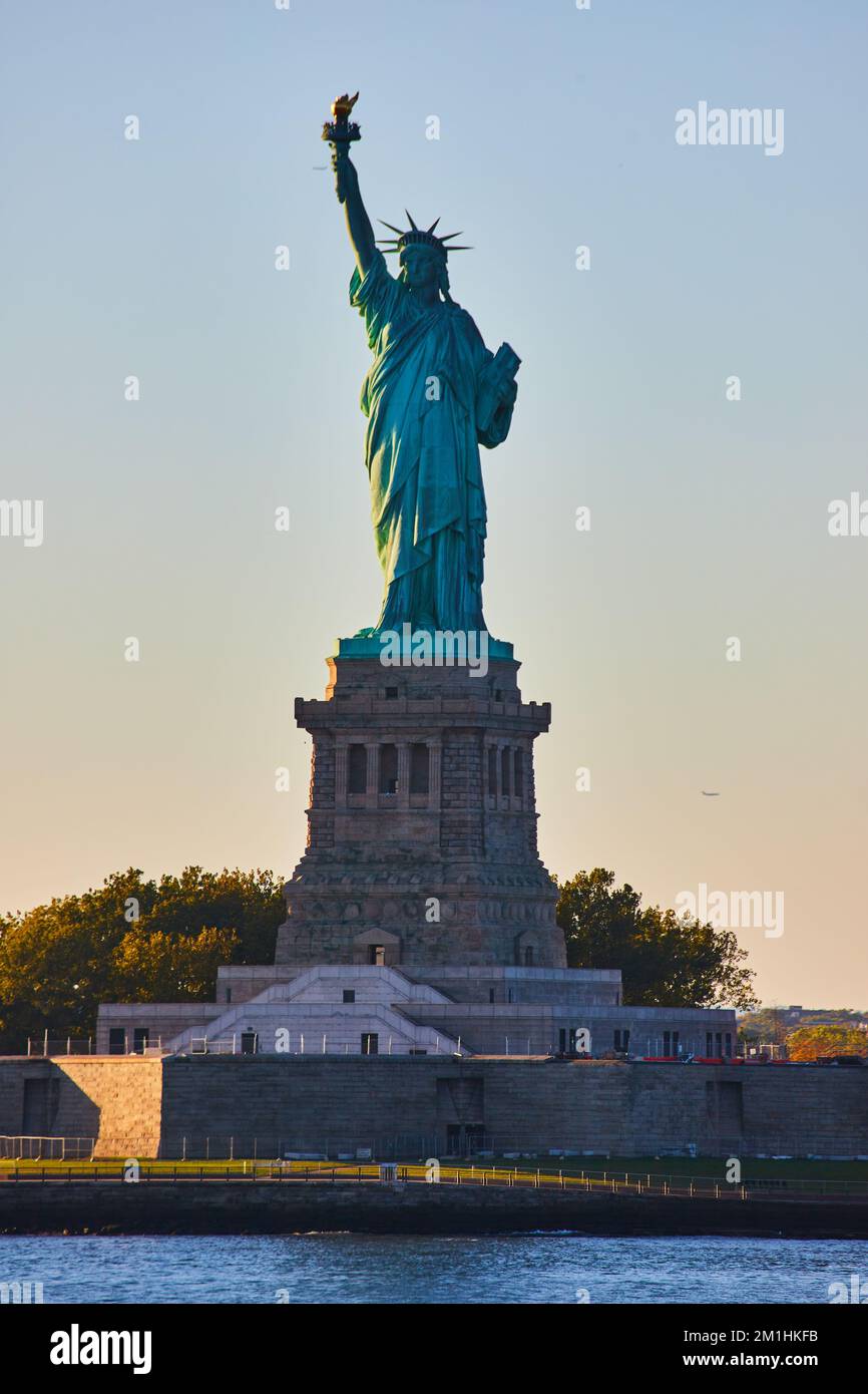 New York City Statue of Liberty iconic silhouette in golden light Stock ...