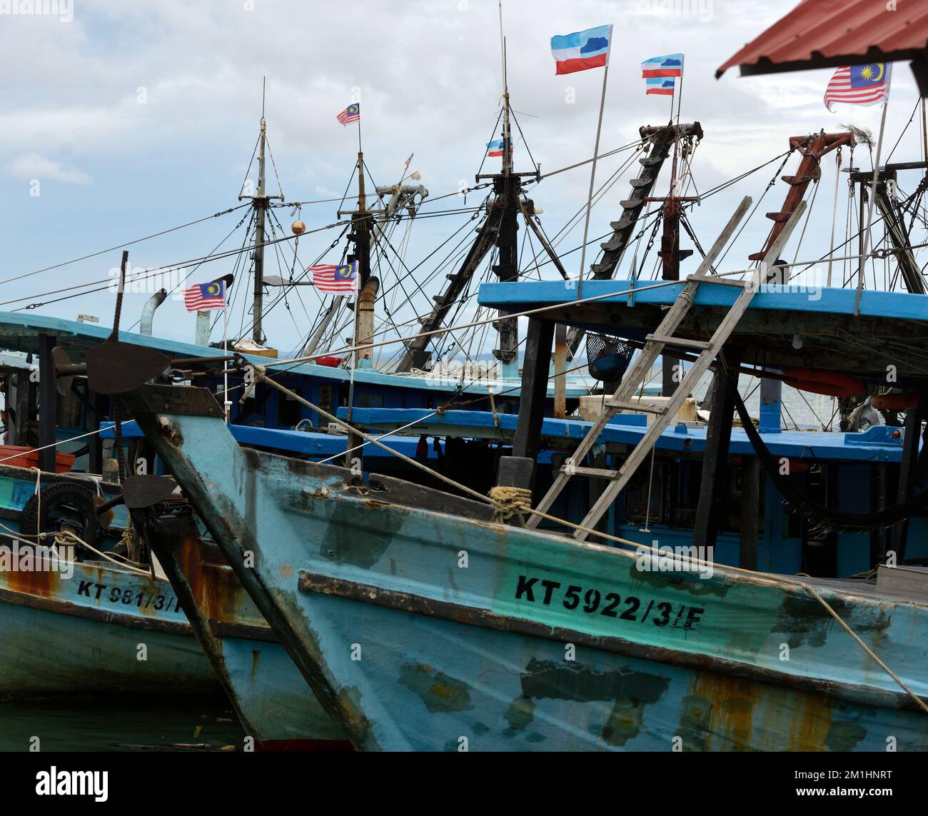 Fishing boats operated by the indigenous Rungus people in Kudat harbour on the Sulu Sea. Sabah, Borneo, Malaysia. Stock Photo