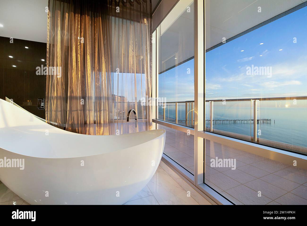 Luxury apartment with views of seaside from bathroom tub Stock Photo ...
