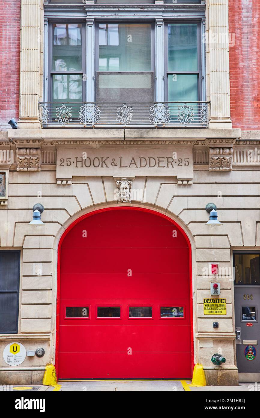 New York City outside fire station 25 Hook and Ladder with huge red door straight on Stock Photo