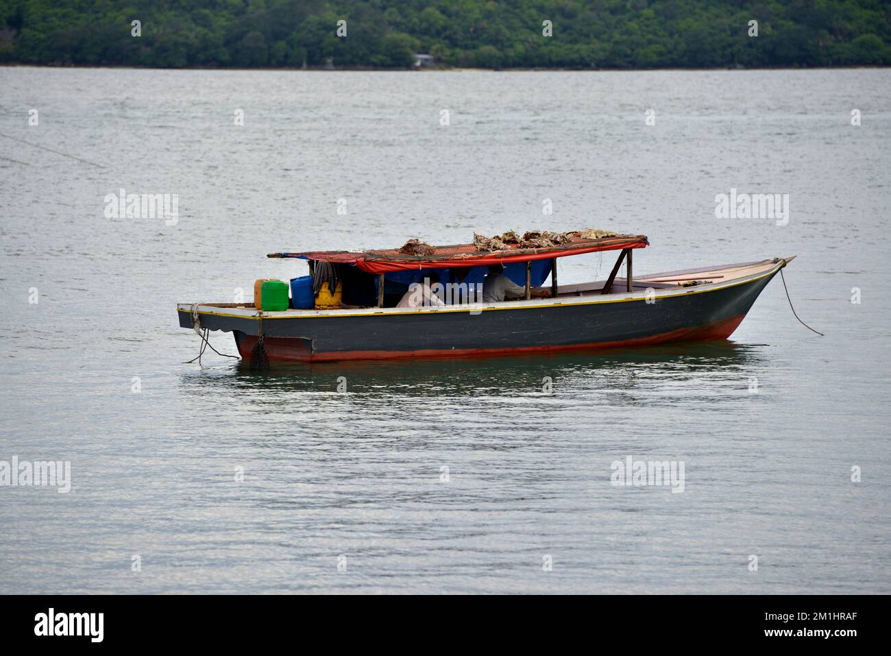 People on a fishing boat in Kudat, Sabah, Borneo, Malaysia. Stock Photo
