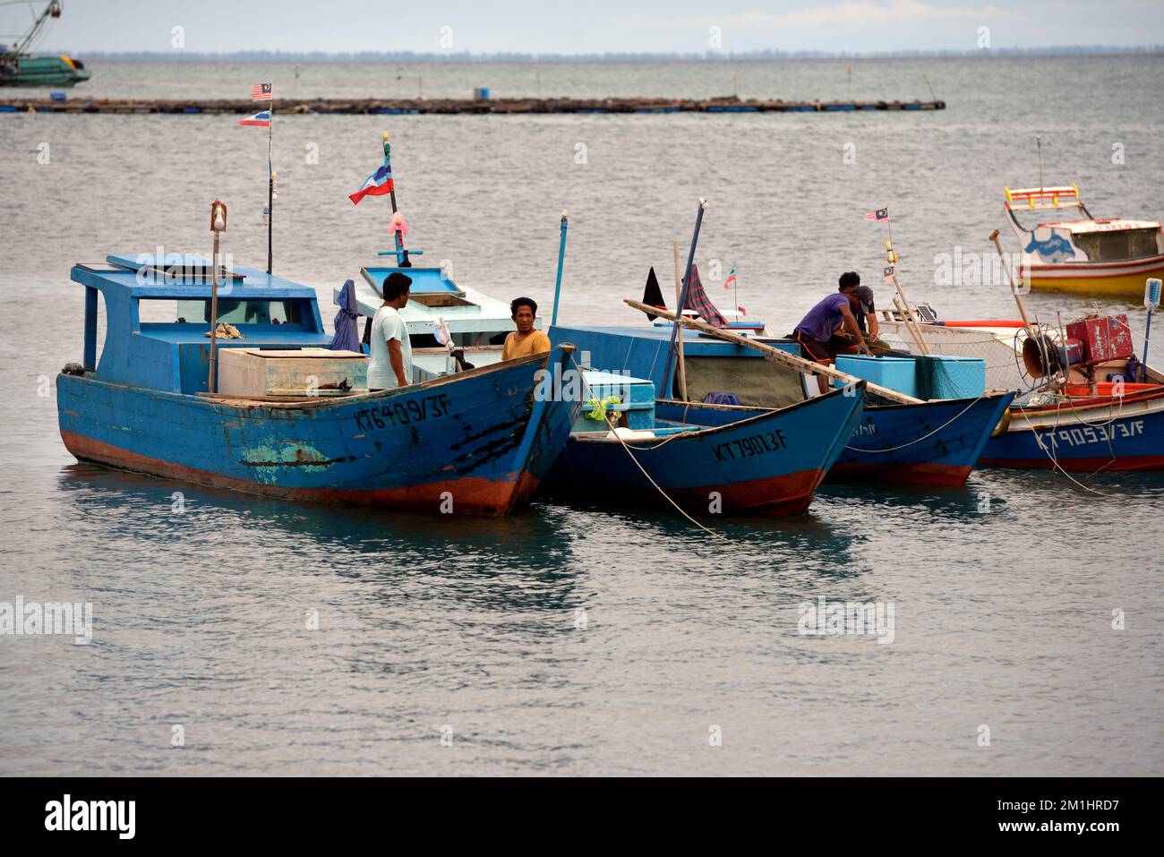 People on fishing boats in Kudat, Sabah, Borneo, Malaysia. Stock Photo
