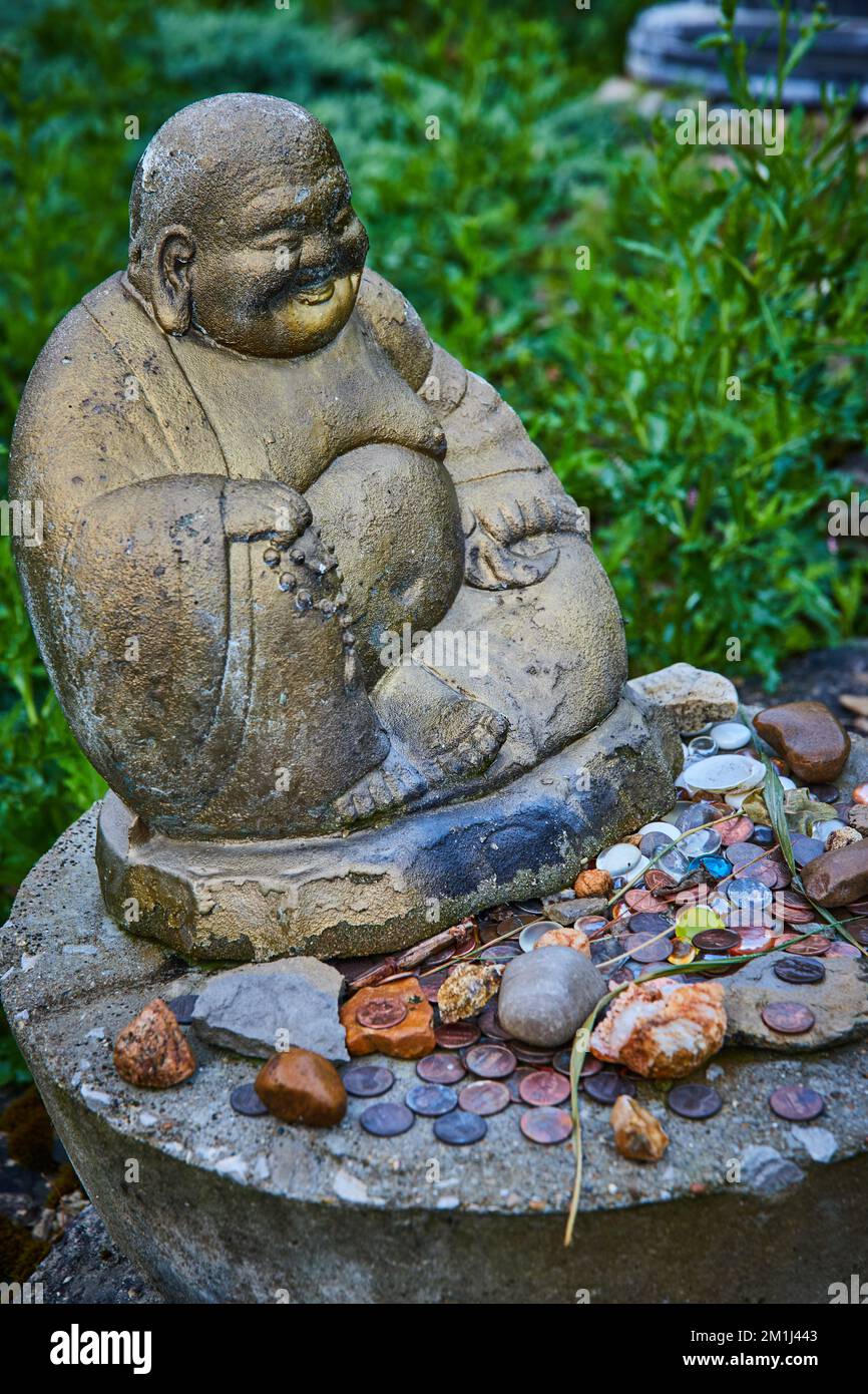 Tibetan Mongolian Buddhist statue with collection of rocks Stock Photo ...