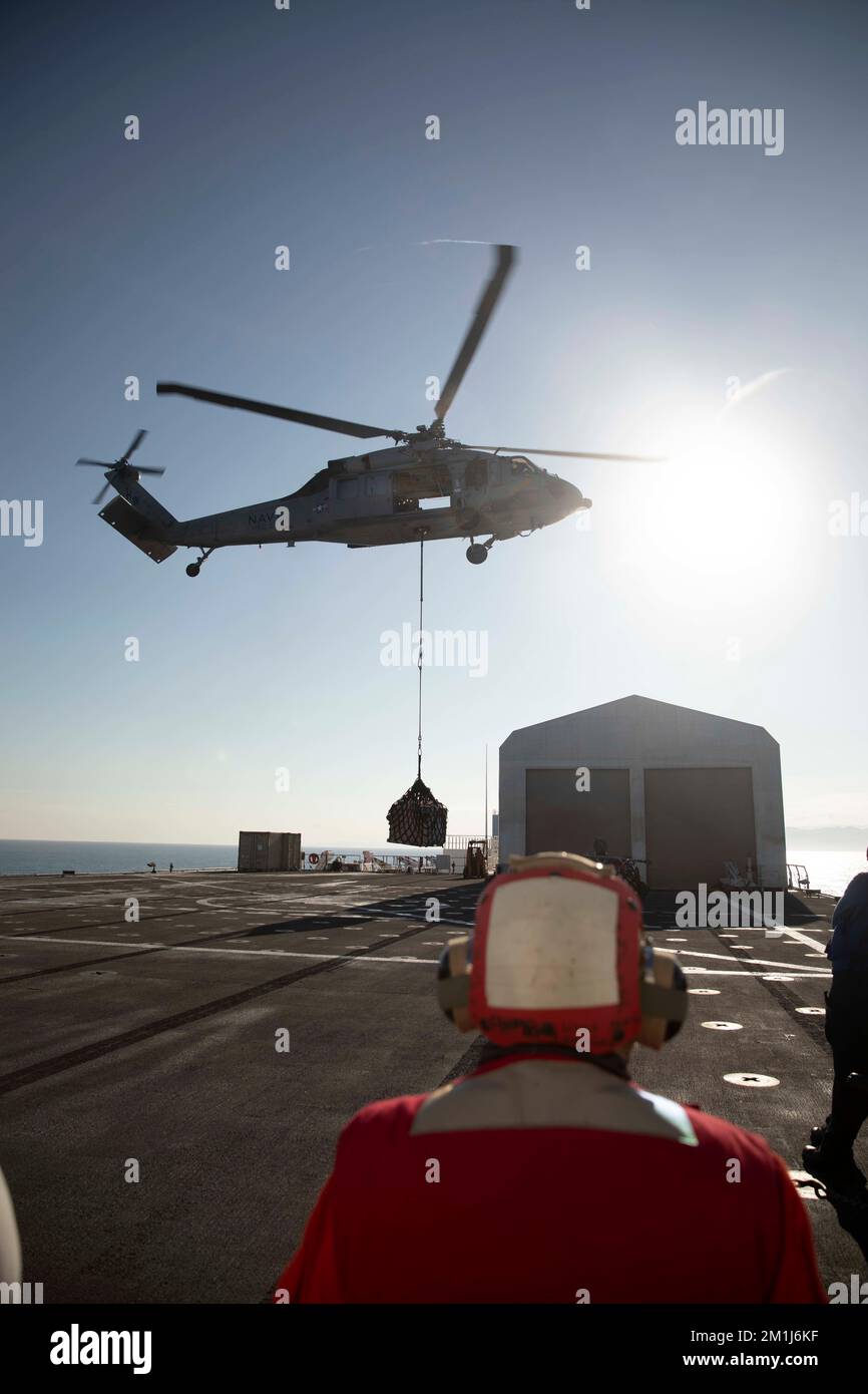 JEREMIE, Haiti (Dec. 12, 2022) Sailors aboard the hospital ship USNS Comfort (T-AH 20) refuel an MH60-S Seahawk, attached to the “Chargers” of Helicopter Sea Combat Squadron (HSC) 26, off the coast of Jeremie, Haiti, Dec. 12, 2022. Comfort is deployed to U.S. 4th Fleet in support of Continuing Promise 2022, a humanitarian assistance and goodwill mission conducting direct medical care, expeditionary veterinary care, and subject matter expert exchanges with five partner nations in the Caribbean, Central and South America. (U.S Army photo by Sgt. Ruben Rodriguez Santiago) Stock Photo