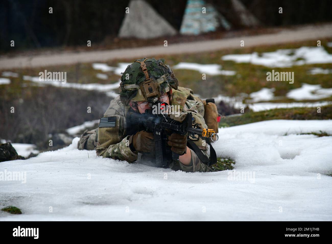 A U. S. Army Paratrooper assigned to the Bastion Company, 54th Brigade Engineer Battalion, 173rd Airborne Brigade, engages a target during squad blank-fire and tactical movement training at Bloska Polica Range in Postonja, Slovenia, Dec. 6, 2022. The 173rd Airborne Brigade is the U.S. Army Contingency Response Force in Europe, capable of projecting ready forces anywhere in the U.S. European, Africa or Central Commands' areas of responsibility. (U.S. Army Photo by Paolo Bovo) Stock Photo