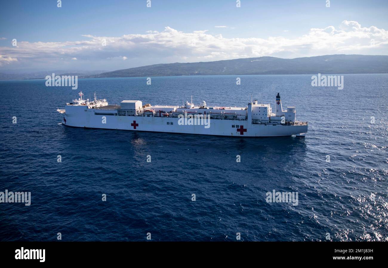 221211-N-VQ841-1304  Hospital ship USNS Comfort (T-AH 20) sails off the coast of Jeremie, Haiti, Dec. 11, 2022. Comfort is deployed to U.S. 4th Fleet in support of Continuing Promise 2022, a humanitarian assistance and goodwill mission conducting direct medical care, expeditionary veterinary care, and subject matter expert exchanges with five partner nations in the Caribbean, Central and South America. (U.S. Navy photo by Mass Communication Specialist 2nd Class Ethan J. Soto) Stock Photo
