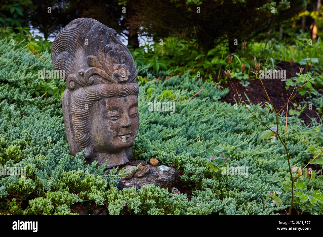 Stone head in gardens for Tibetan Mongolian Buddhist Stock Photo Alamy