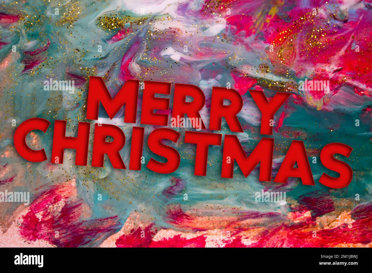 Abstract Natural Luxury art, fluid painting with Merry Christmas text, alcohol ink technique. Image incorporates the swirls of marble granite. Stock Photo