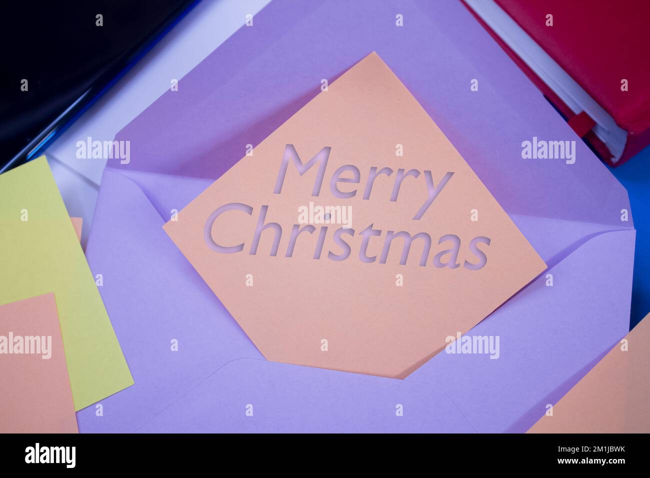 Merry Christmas. Text on adhesive note paper. Event, celebration reminder message. Stock Photo
