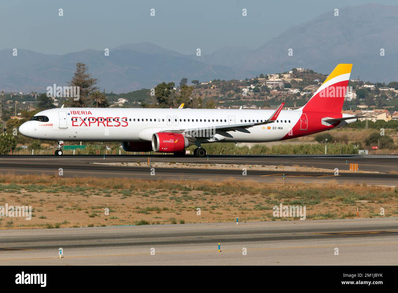An Iberia Express Airbus 321 NEO ready to take off from Malaga Costa del sol airport.Iberia Express is a Spanish low-cost airline owned by Iberia, which operates short- and medium-haul routes from its parent airline's hub at Adolfo Suárez Madrid–Barajas Airport, providing feeder flights onto Iberia's long-haul network. Stock Photo