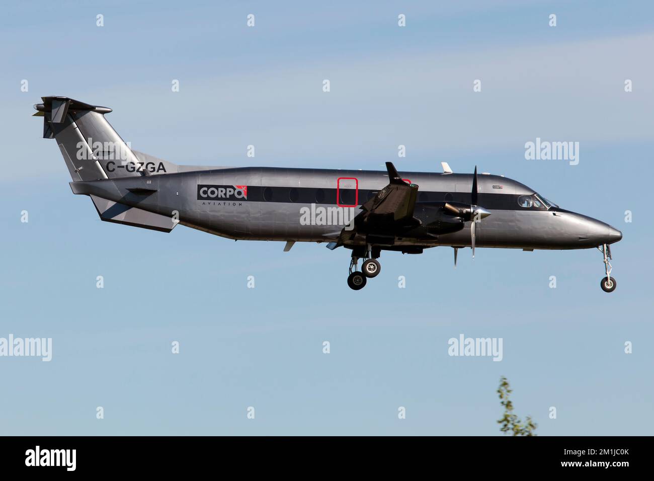 A Corpo Aviation Beechcraft 1900D landing at Quebec City airport.Corpo Aviation is a Quebec’s regional corporate carrier. Stock Photo