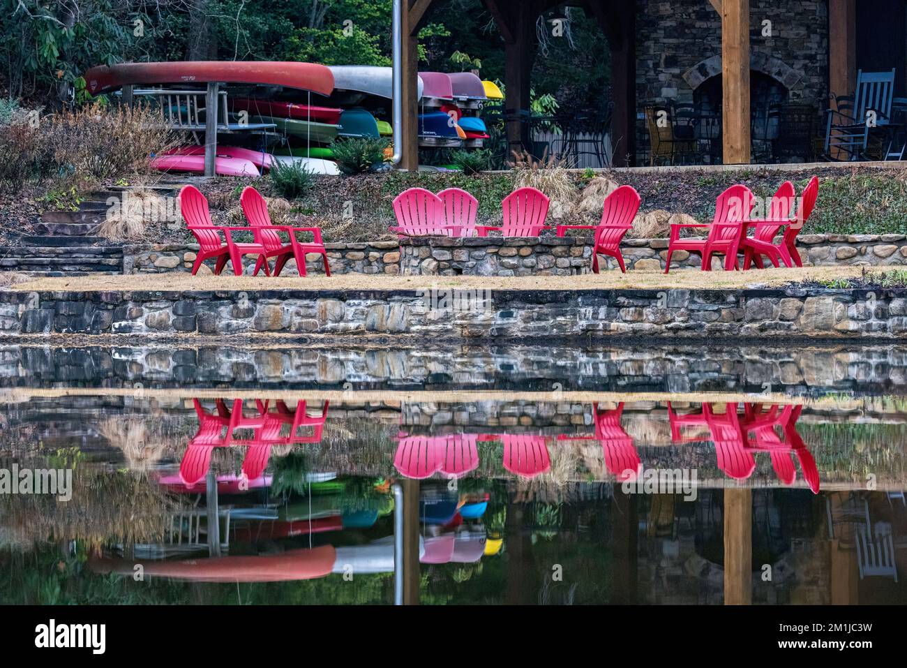 Colorful chairs around fire pit at the Straus Park Lakehouse - Brevard, North Carolina, USA Stock Photo
