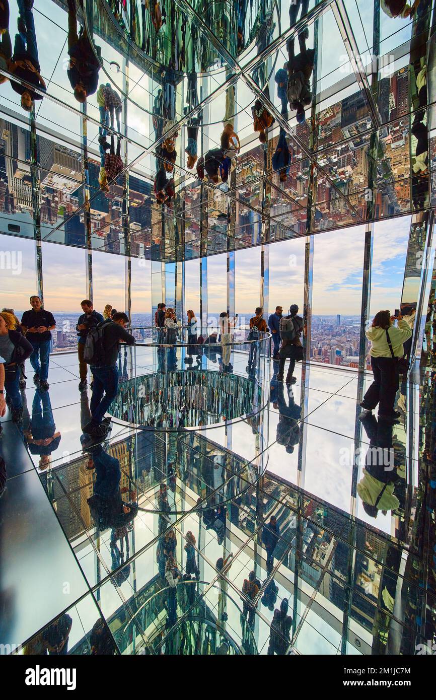 Tourists in Summit One reflection mirror rooms overlooking New York