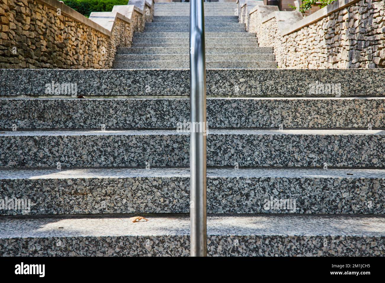 Endless limestone steps symmetrically leading into distance Stock Photo