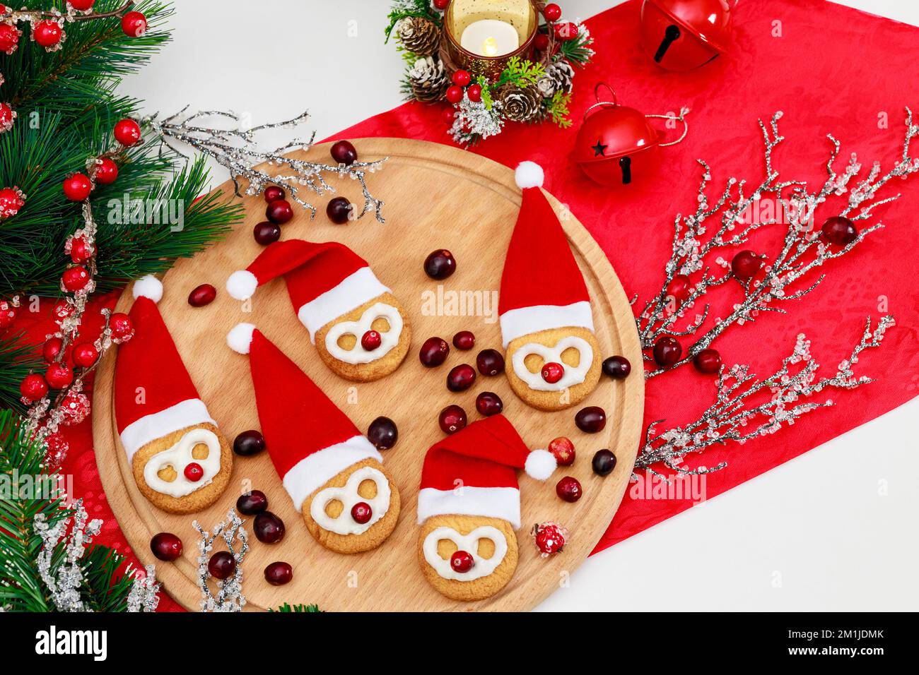 Making Christmas cookies from shortbread cookies Stock Photo - Alamy