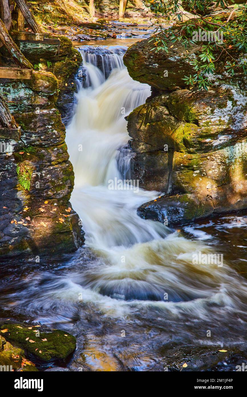 Waterfall Through Rocks Detail of small waterfall through rocks covered in lichen and moss ...