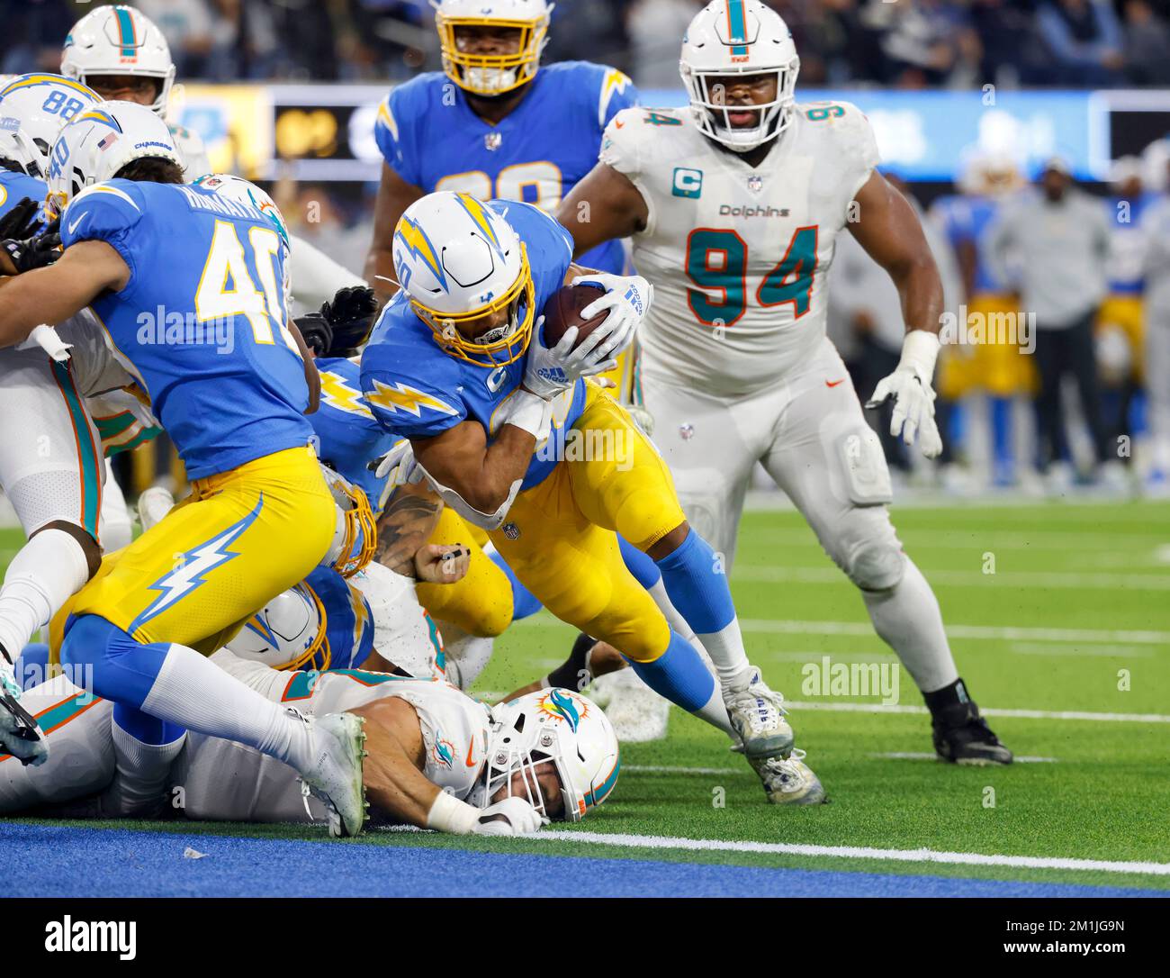 Miami Gardens, Florida, USA. 29th Sep, 2019. Miami Dolphins running back  Mark Walton (22) secures the ball tackled by Los Angeles Chargers middle  linebacker Denzel Perryman (52) during an NFL football game