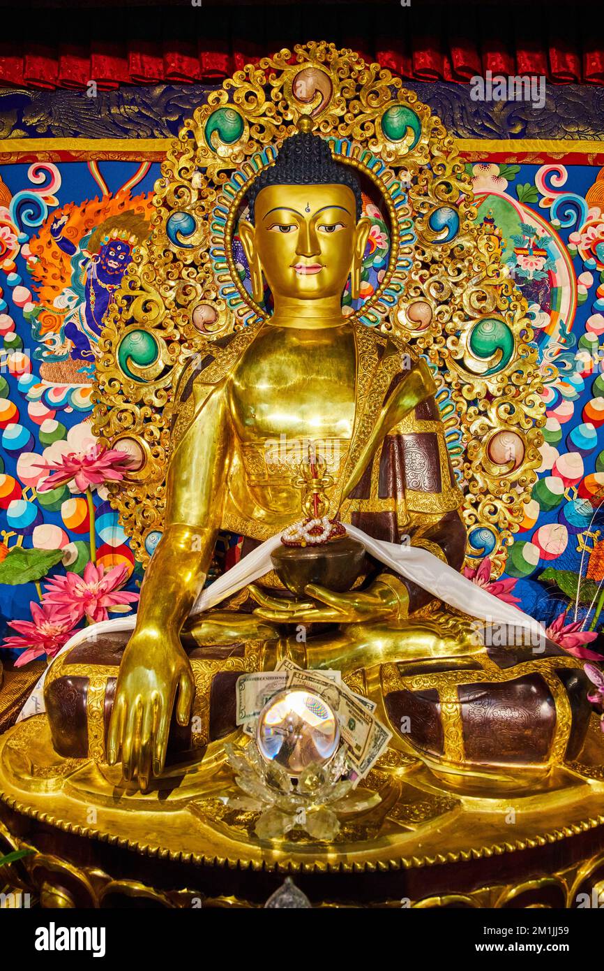 Ornate Tibetan Mongolian Buddhist statues inside of shrine Stock Photo