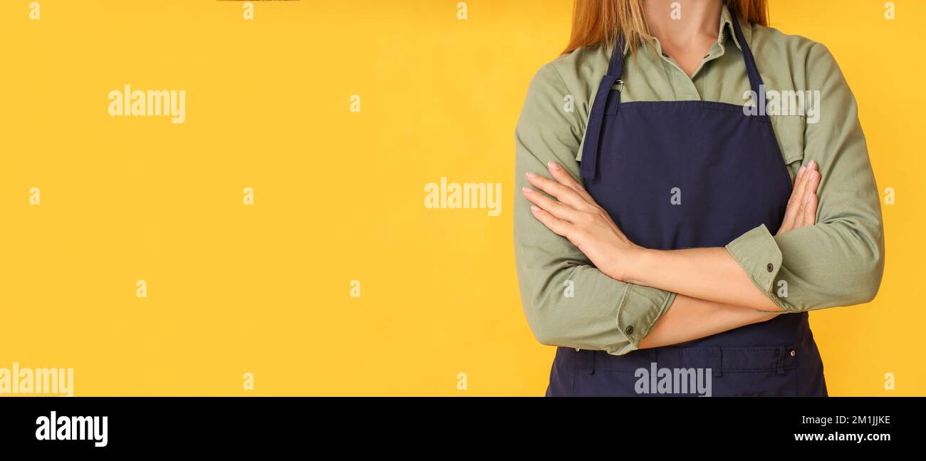 Barista wearing yellow apron hi-res stock photography and images - Alamy
