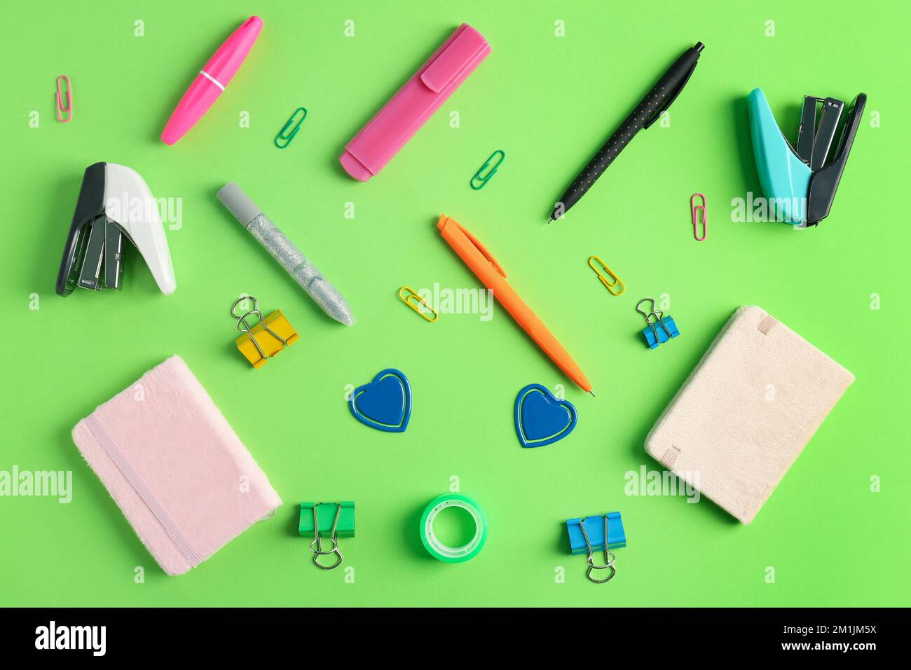 Composition with different stationery on green background Stock Photo