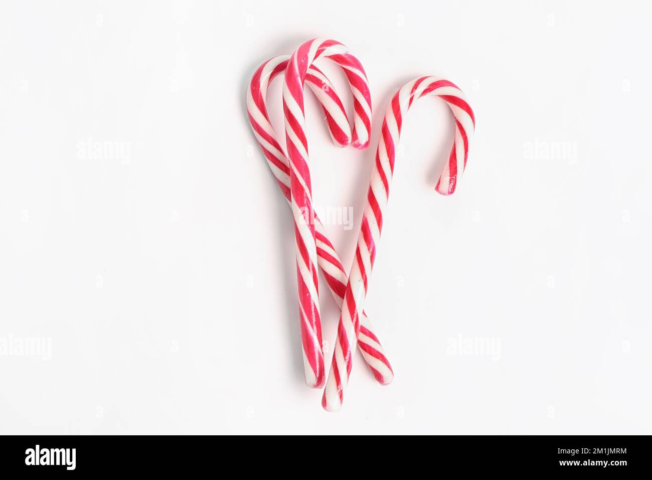 Candy canes isolated on white background Stock Photo - Alamy