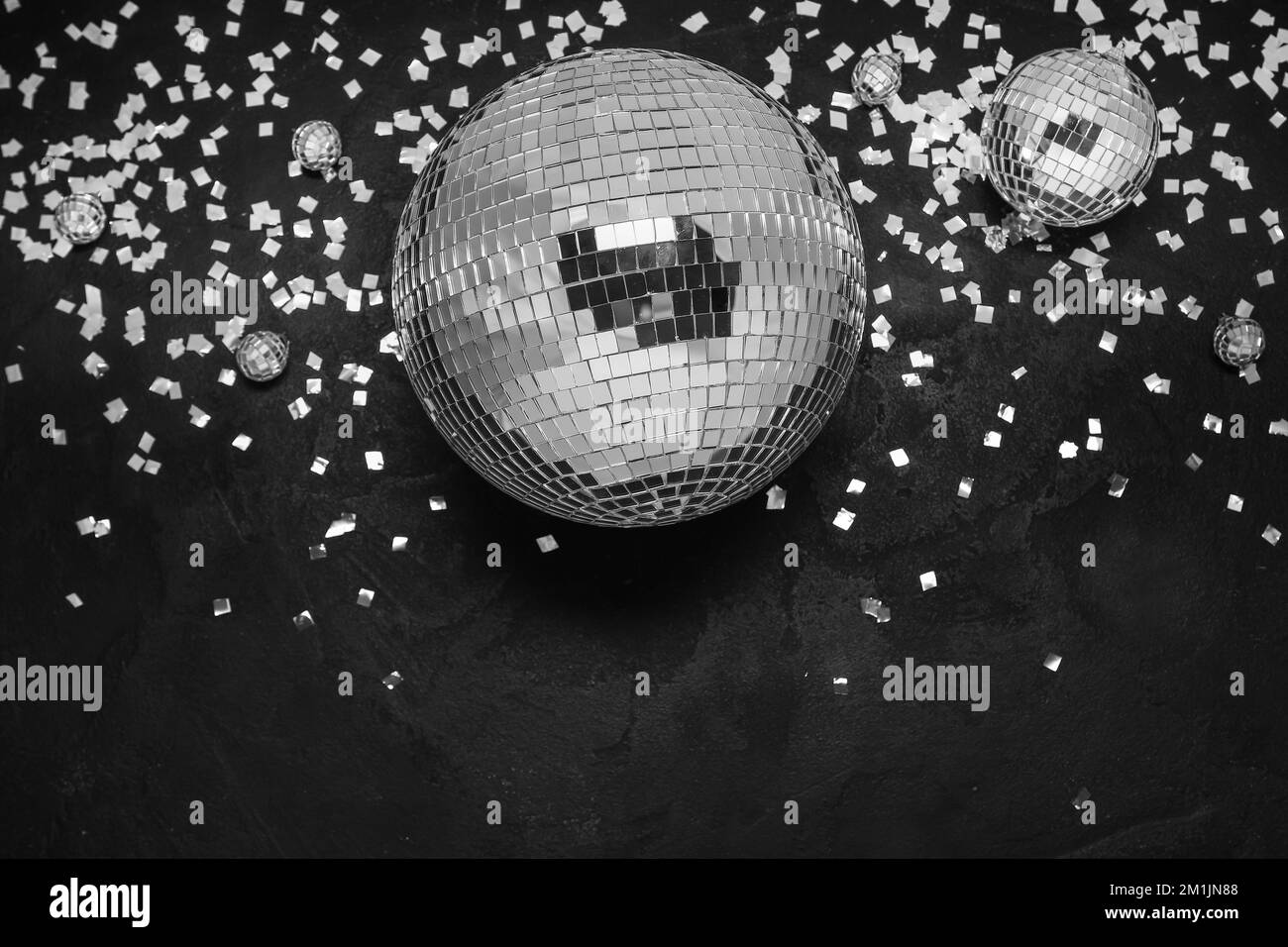 Disco balls with confetti on black background Stock Photo Alamy