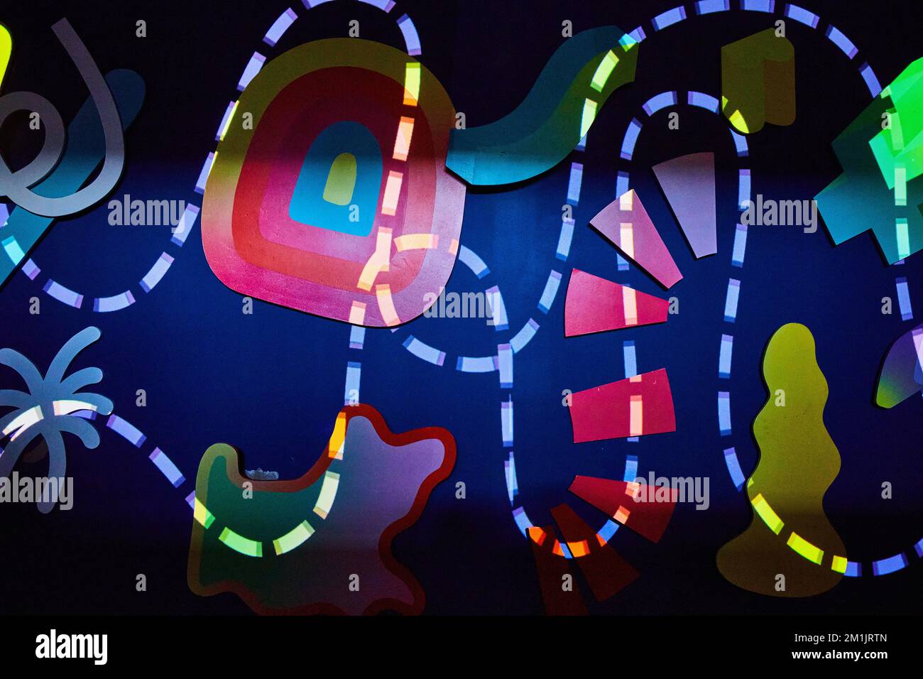 Abstract lights on wall with dashed line and shapes Stock Photo