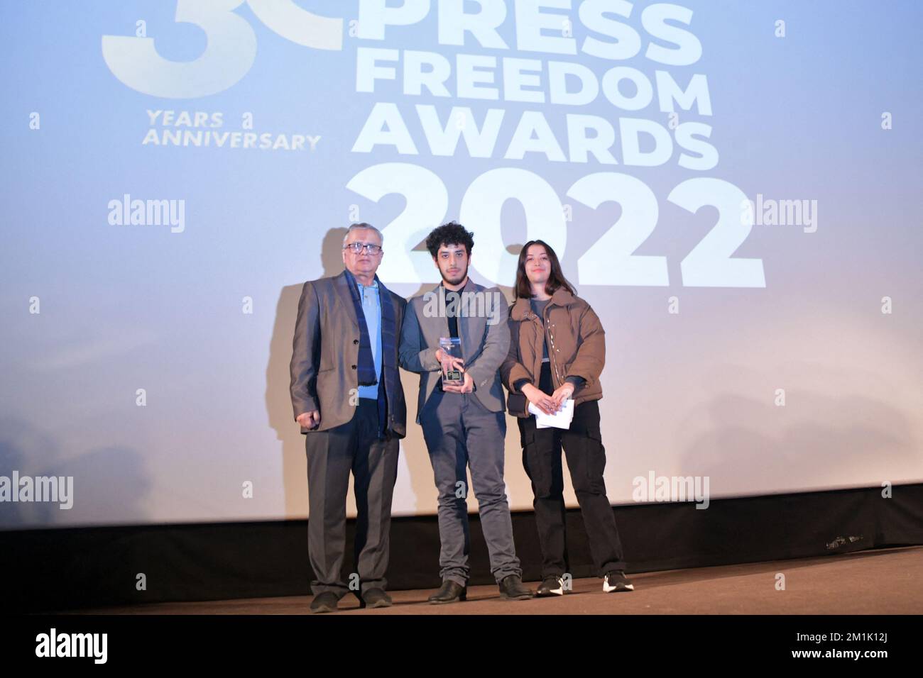 Champs Elysees, in Paris, 12/12/2022, The children and husband (L) of the Iranian journalist Narges Mohammadi who won the Courage Award and is in prison in Iran actually, during the RSF Press Freedom Awards 2022 ceremony in the presence of Nobel Peace Prize laureate Dmitry Muratov, at Gaumont Champs Elysees, in Paris, France, on December 12, 2022. Photo Jana Call me J/ABACAPRESS.COM Stock Photo