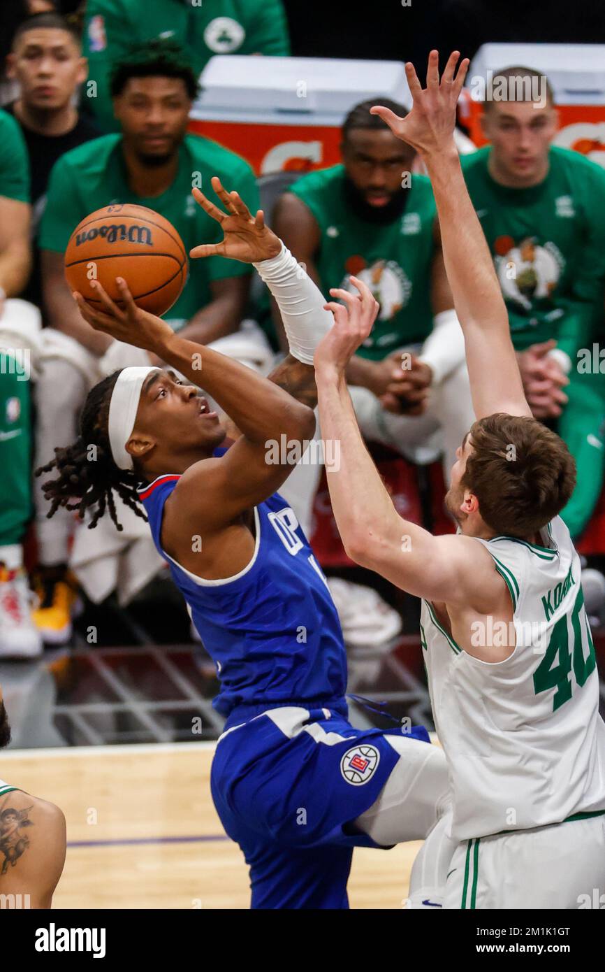 Los Angeles, California, USA. 12th Dec, 2022. Los Angeles Clippers guard Terance Mann (14) shoots against Boston Celtics center Luke Kornet (40) during an NBA basketball game Monday, December 12, 2022, in Los Angeles. (Credit Image: © Ringo Chiu/ZUMA Press Wire) Stock Photo