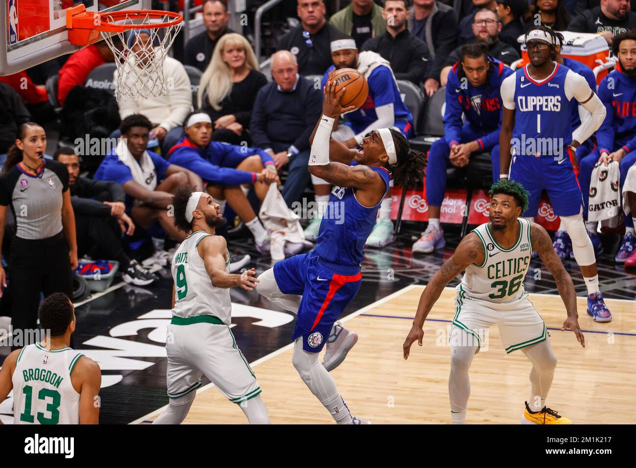 Los Angeles, California, USA. 12th Dec, 2022. Los Angeles Clippers guard Terance Mann (14) shoots over Boston Celtics guard Derrick White (9) during an NBA basketball game Monday, December 12, 2022, in Los Angeles. (Credit Image: © Ringo Chiu/ZUMA Press Wire) Stock Photo