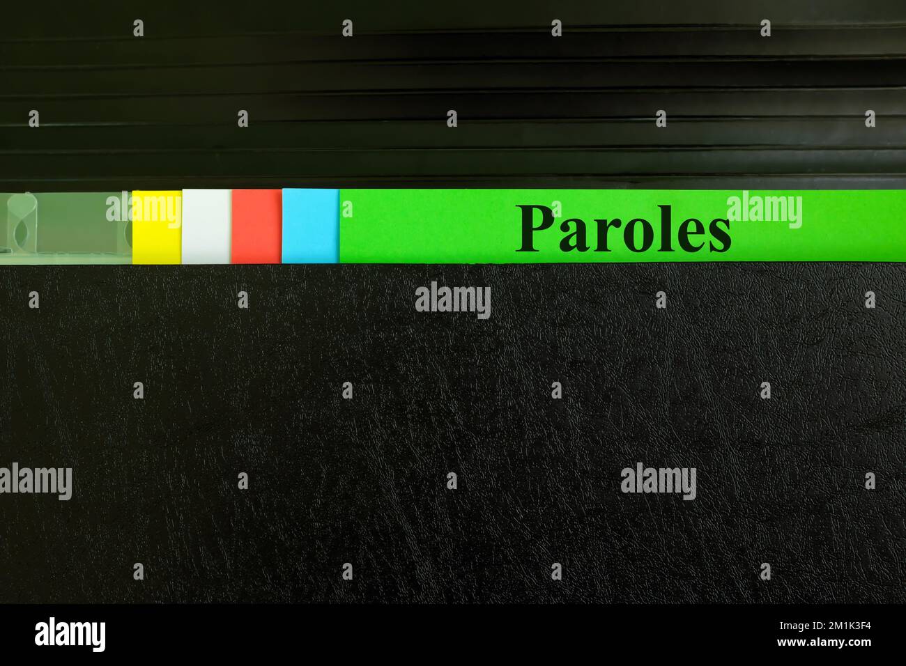 Hand picking parole file record in black binder folder. Paroles criminal law legal and justice concept. Stock Photo