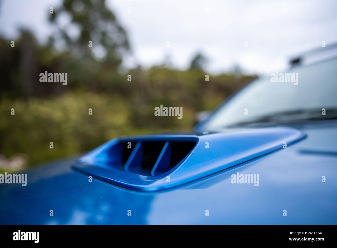 car on a truck with a turbo blue Stock Photo Alamy