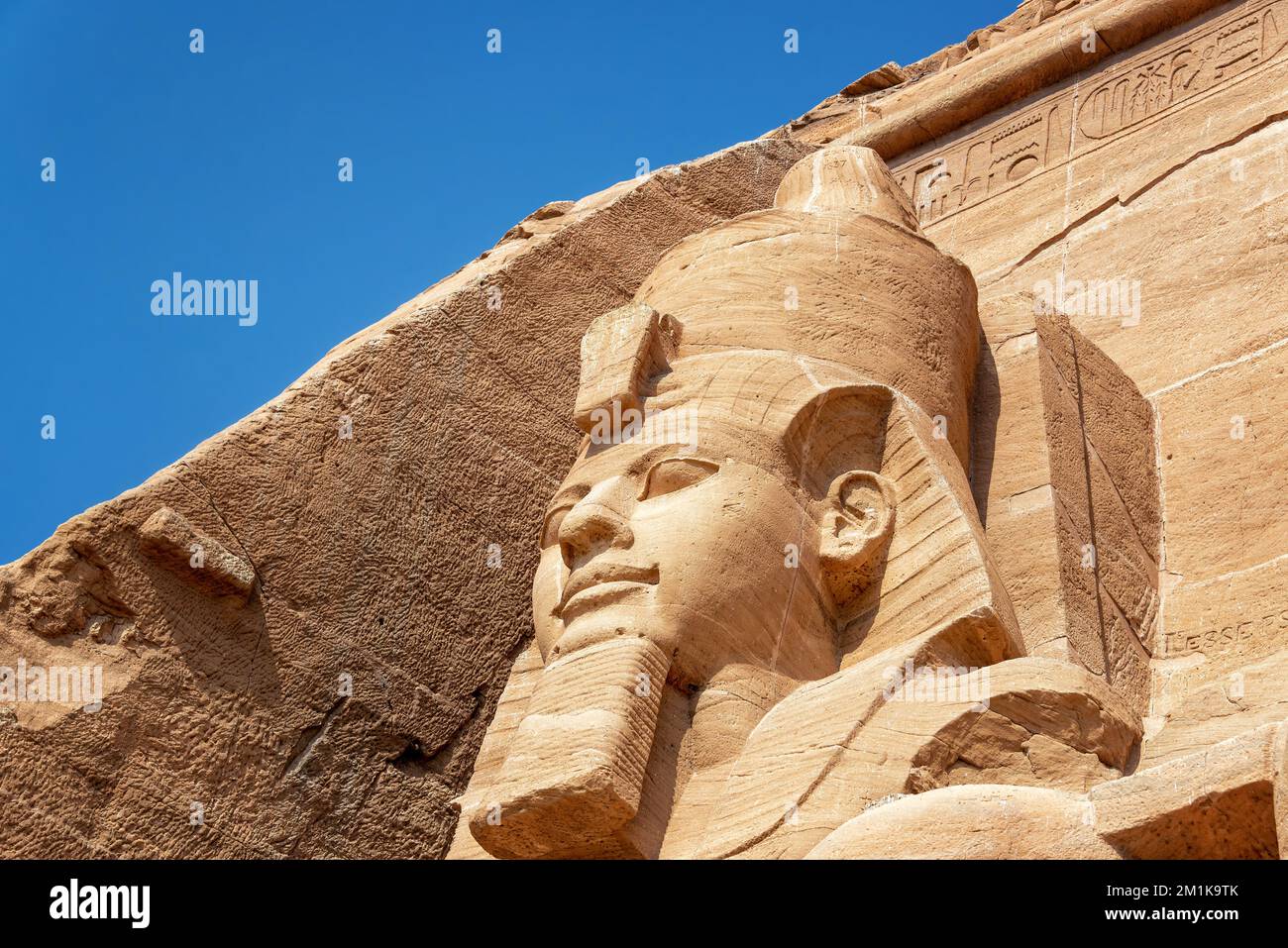 Closeup view of one of the statues at the temple of Abu Simbel in Egypt Stock Photo