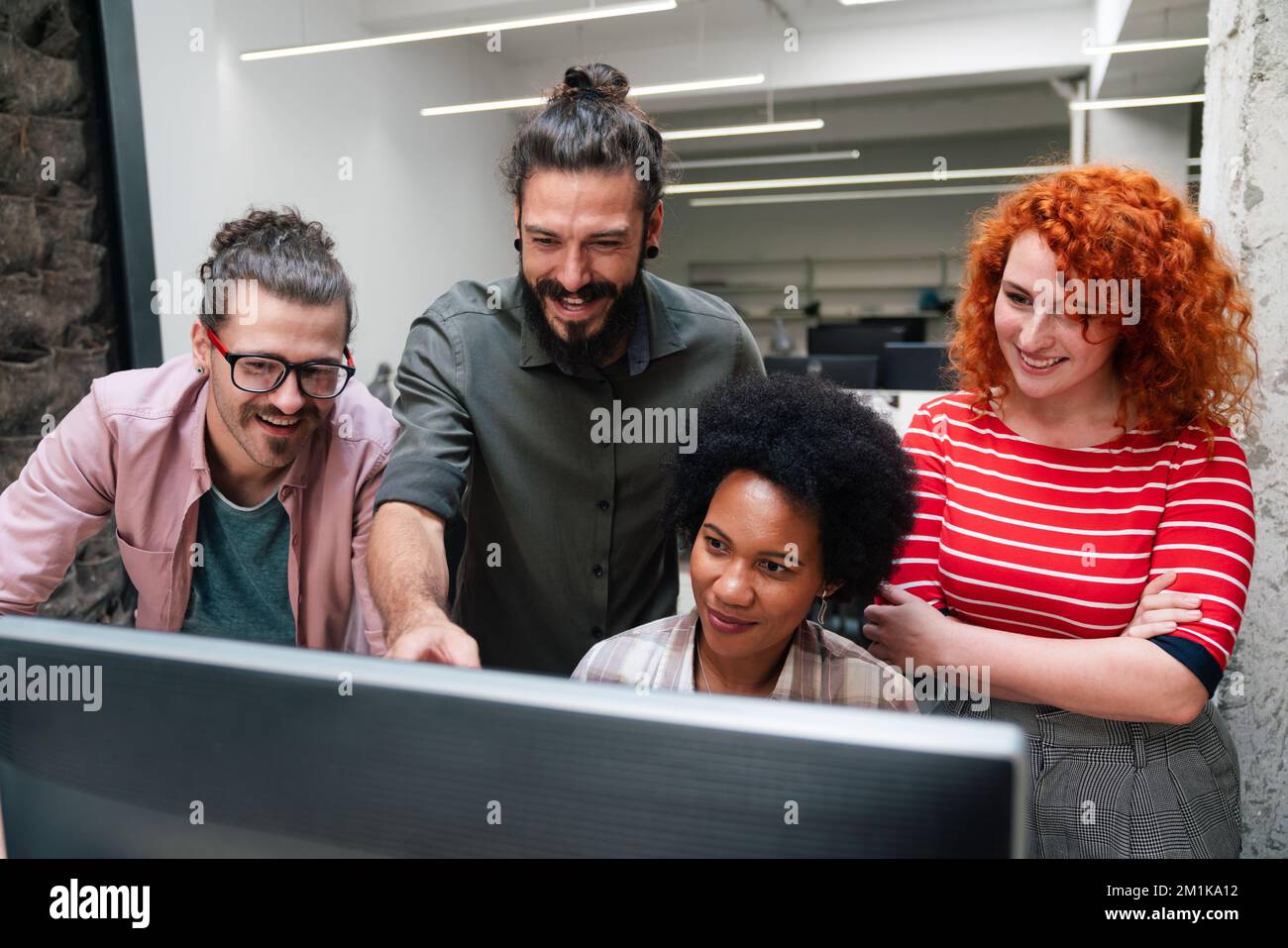 Programmers cooperating at IT company developing apps. People business work office concept Stock Photo