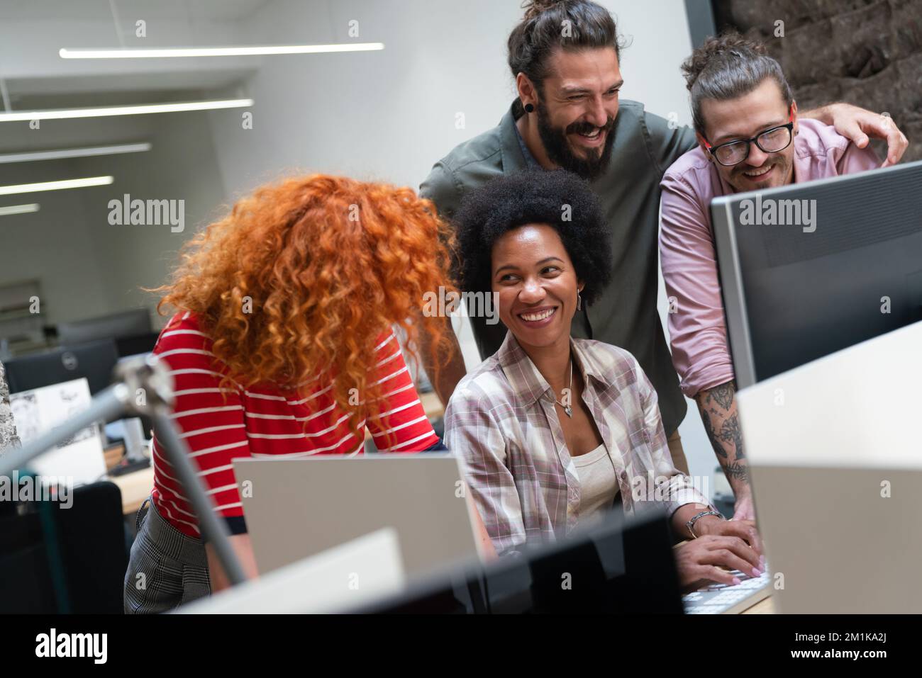 Programmers cooperating at IT company developing apps. People business work office concept Stock Photo
