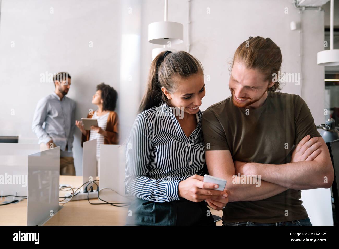 Programmers cooperating at IT company developing apps. People business work office concept Stock Photo