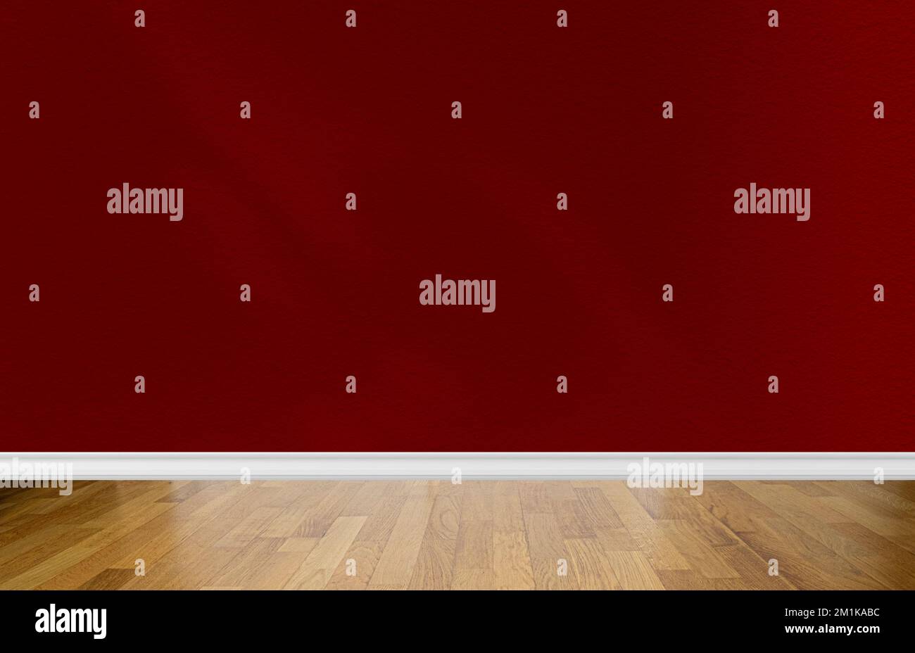 Interior of a room with blank red wall, abstract shadows and pine parquet floor. Space for text Stock Photo