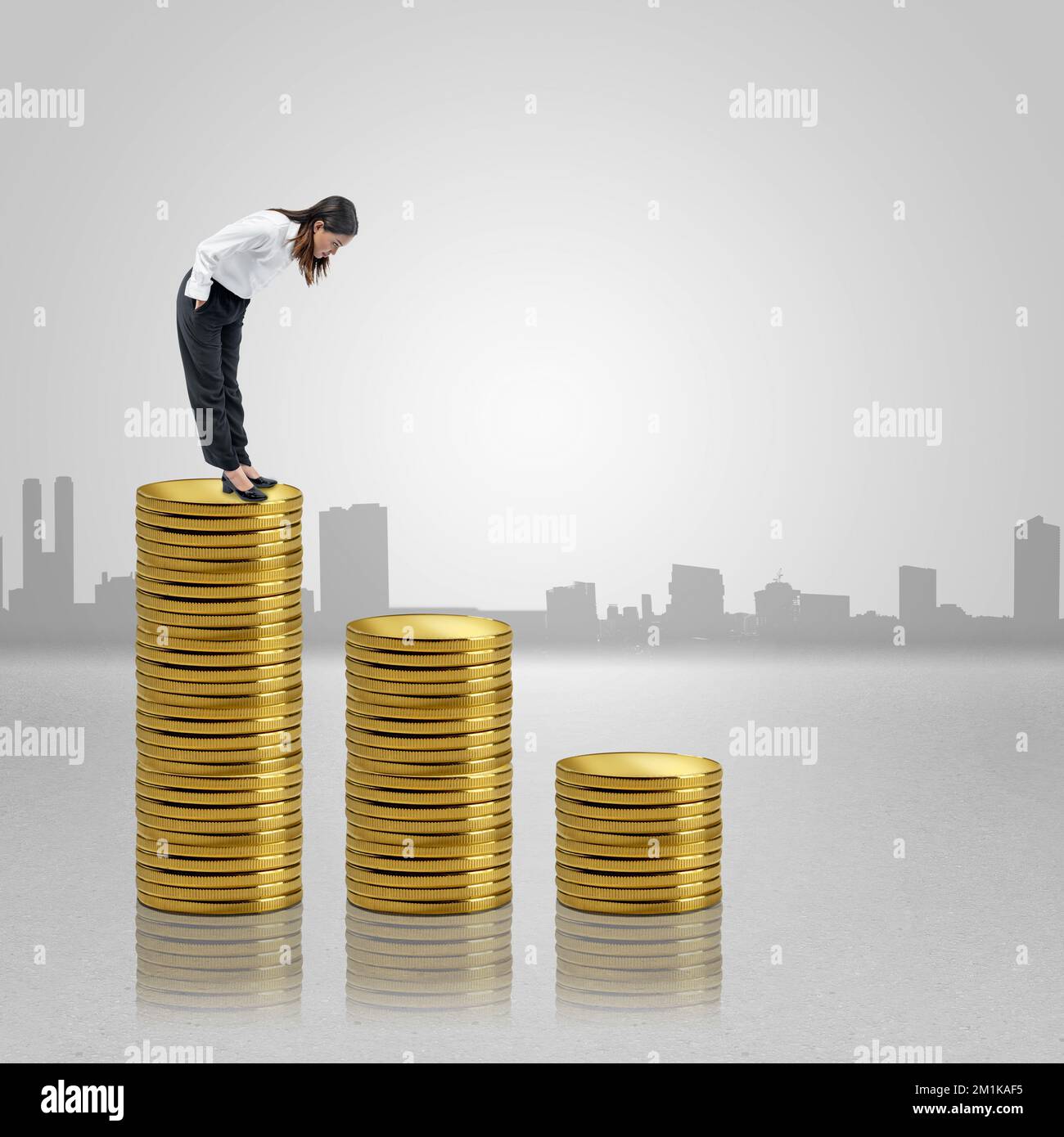 Asian businesswoman standing and looking down the coin stack with ...
